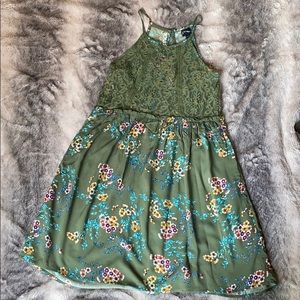 green dress with floral accents and laced top